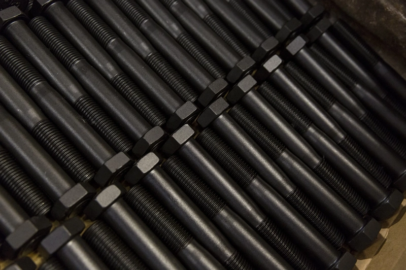 Neat rows of Manganese Phosphate coated bolts